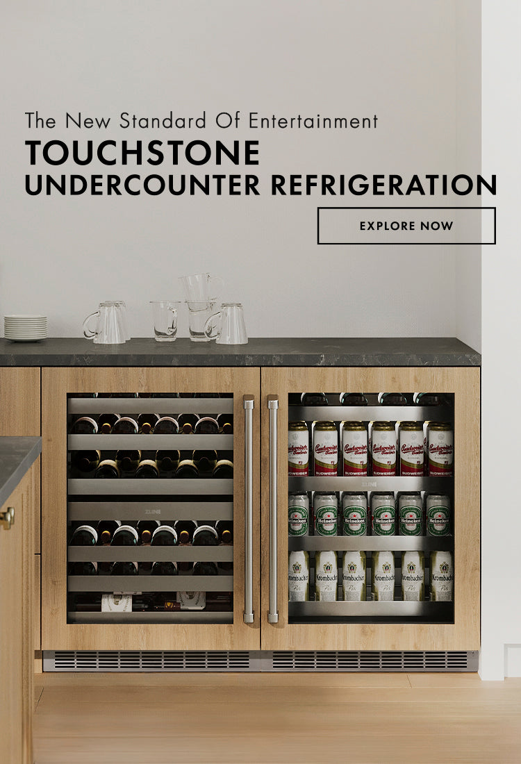 Undercounter Wine and Beverage Refrigerators with wood panels. Text: The New Standard of Entertainment. Touchstone Undercounter Refrigeration. Button: Explore Now.